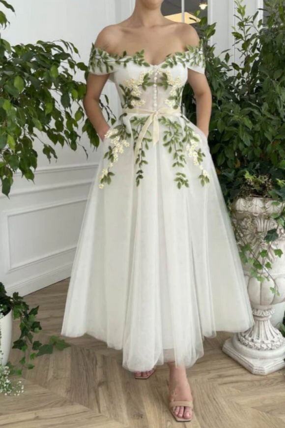wedding dress with green leaf 10 Stunning, Detailed Wedding Dresses Weddings Today