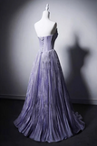 Purple evening gown on a mannequin against a gray background